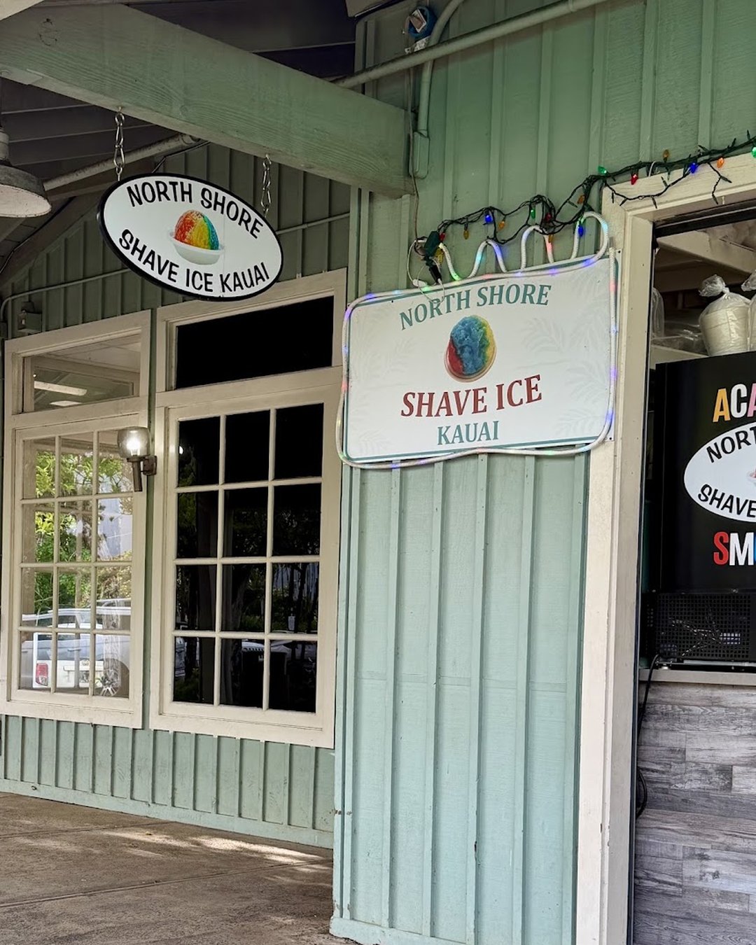 North Shore Shave Ice Kauai storefront with both shop signs under a blue sky